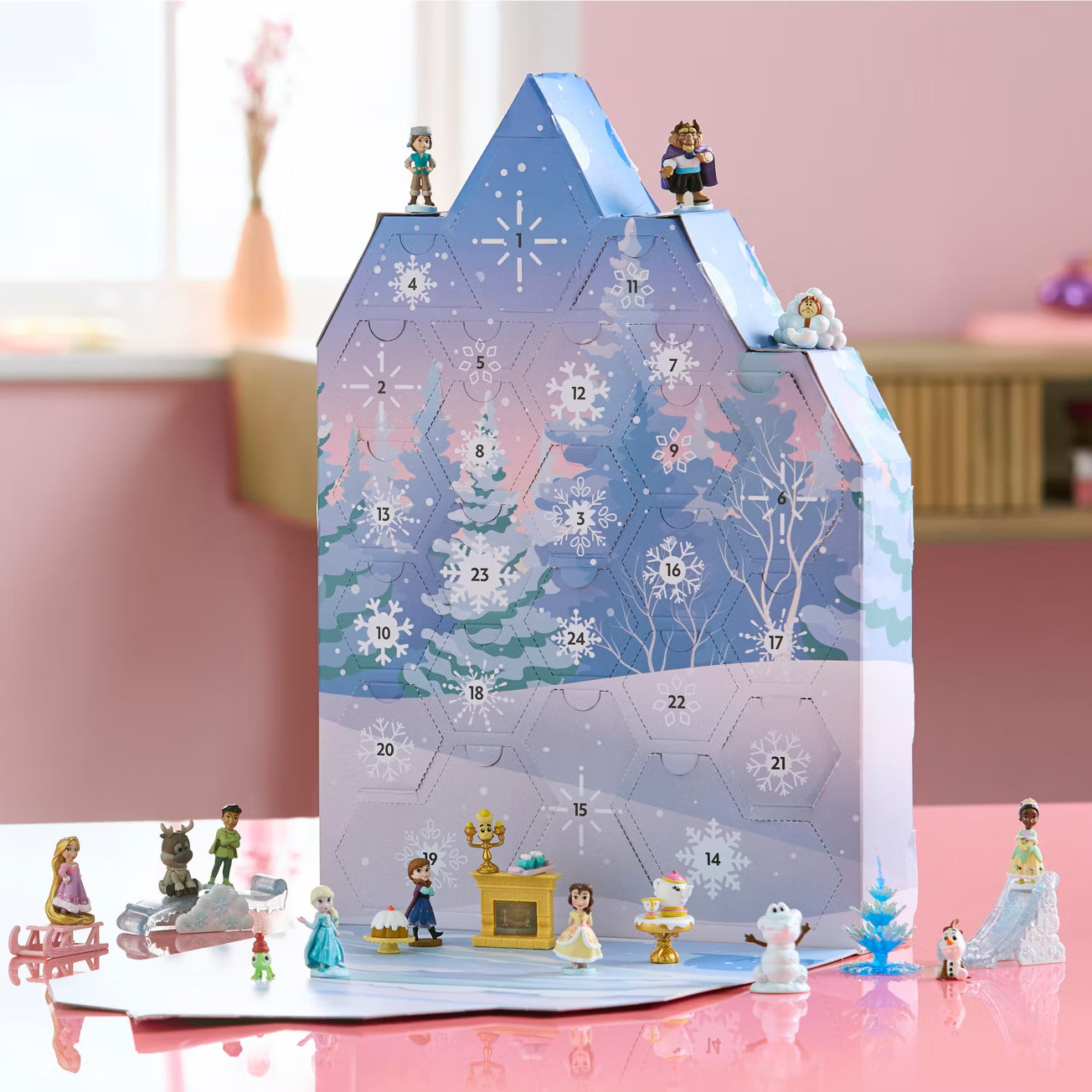 Disney micro figurines including Anna, Elsa, Belle, and Rapunzel interacting